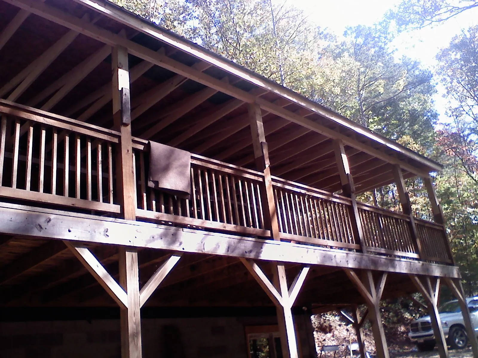 Timber framing under a new elevated porch and deck — Roof Leak Repair in South Burlington by Roofing Brothers